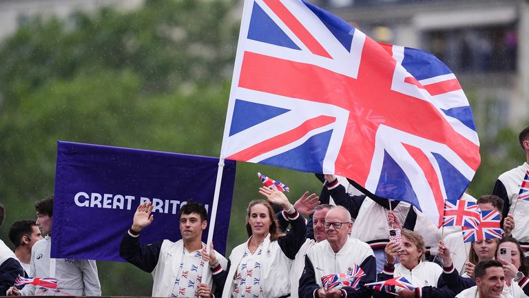 Great Britain flag bearers Thomas Daley and Helen Glover and the Great Britain Olympic team during the opening ceremony of the Paris 2024 Olympic Games in France. Picture date: Friday July 26, 2024. PA Photo. Photo credit should read: John Walton/PA Wire..RESTRICTIONS: Use subject to restrictions. Editorial use only, no commercial use without prior consent from rights holder.