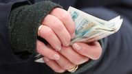 Horse Racing - Cheltenham Festival - Cheltenham Racecourse, Cheltenham, Britain - March 12, 2019 A racegoer holds money at the Cheltenham Festival Action Images via Reuters/Paul Childs