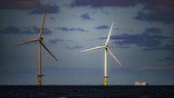 File photo dated 26/07/2022 of a ship passing wind turbines at RWE's Gwynt y Mor, the world's 2nd largest offshore wind farm located eight miles offshore in Liverpool Bay, off the coast of North Wales. The Crown Estate is to pay even more money to the Treasury after benefiting from a massive licensing round for offshore wind power last year. The company, which owns the seabed around the UK, said it made £442.6 million in net revenue profit in the year to the end of March, money that will go to h