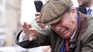 Nigel Farage reacts after something is thrown towards him on the Reform UK campaign bus.
Pic:PA