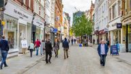 Shoppers and tourists strolling around Manchester City Centre stock photo...

