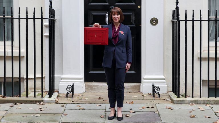 Britain's Chancellor of the Exchequer Rachel Reeves poses with the red budget box outside her office on Downing Street in London, Britain October 30, 2024. REUTERS/Isabel Infantes