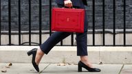 Britain's Chancellor of the Exchequer Rachel Reeves walks with the red budget box outside her office on Downing Street in London, Britain October 30, 2024. REUTERS/Mina Kim