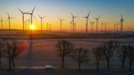 07 February 2023, Brandenburg, Jacobsdorf: Sunrise over the wind energy park "Odervorland" (aerial view with a drone). According to the Bundesverband WindEnergie e.V. (German Wind Energy Association), the inland state of Brandenburg ranks second among the German states with the largest installed capacity of wind turbines. Thus, about one third of the electricity demand is generated from wind. With over 7,864 MW (megawatts) of total installed capacity, Brandenburg now ranks second after Lower Sax