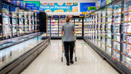 Morrisons drops freezer temperatures
Undated handout photo issued by Morrisons of a shopper in one of its stores in Starbeck Harrogate. Morrisons has turned some of its supermarket freezers up by three degrees in a trial to cut carbon emissions. The supermarket chain, which believes it is the first UK retailer to take the action, said the current industry standard setting freezers to -18C was set almost 100 years ago and had not been updated since, despite improvements in refrigeration. Issue da