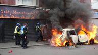 A car burns on Parliament Road, in Middlesbrough, during an anti-immigration protest. Picture date: Sunday August 4, 2024.