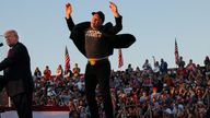 Tesla CEO and X owner Elon Musk reacts next to Republican presidential nominee and former U.S. president Donald Trump during a campaign rally, at the site of the July assassination attempt against Trump, in Butler, Pennsylvania, U.S., October 5, 2024. REUTERS/Brian Snyder REFILE - QUALITY REPEAT