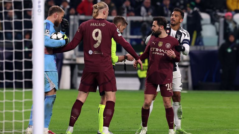 Manchester City's Bernardo Silva with referee Clement Turpin during the UEFA Champions League, league stage match at the Allianz Stadium, Turin, Italy. Picture date: Wednesday December 11, 2024. PA Photo. See PA story SOCCER Man City. Photo credit should read: Fabrizio Carabelli/PA Wire...RESTRICTIONS: Use subject to restrictions. Editorial use only, no commercial use without prior consent from rights holder.