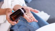 A file picture of a woman taking a supplement. Pic: iStock