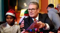 Prime Minister Sir Keir Starmer holds up a card as he and his wife Lady Victoria Starmer host a Christmas party for children from four schools across London, and children supported by Action for Children and young carers from The Honeypot Charity, in 10 Downing Street, London. Picture date: Friday December 13, 2024.
