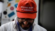 A Trump fan wears a 'Bitcoin made in America' cap