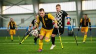 Soccer players of AMP FC Kyiv and MSK Dnipro play during the first football tournament for war-wounded amputees in Kyiv, Ukraine, Jan. 12, 2025. (AP Photo/Evgeniy Maloletka)