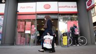 A person walks past a branch of the Post Office in Paddington.
Pic: PA