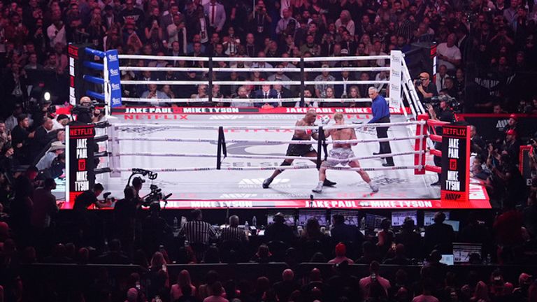 Mike Tyson, left, fights Jake Paul during their heavyweight boxing match, Friday, Nov. 15, 2024, in Arlington, Texas. (AP Photo/Julio Cortez)