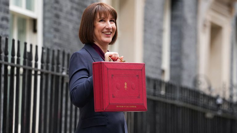 Britain's Chancellor of the Exchequer Rachel Reeves poses with the red budget box outside her office on Downing Street in London, Britain October 30, 2024. REUTERS/Maja Smiejkowska