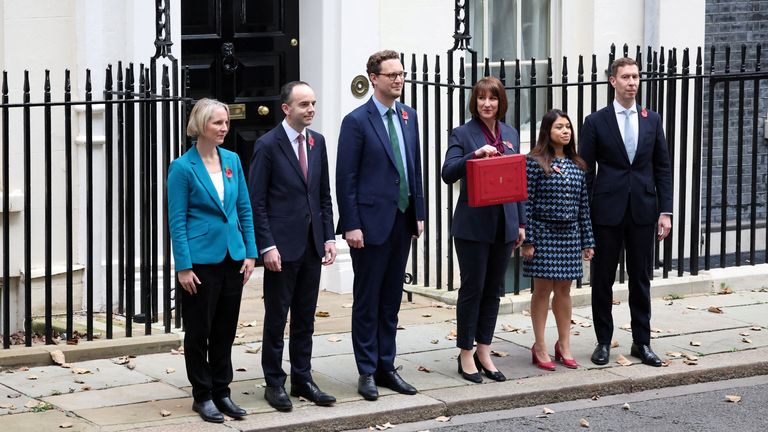 Rachel Reeves poses with the red budget box outside her office on Downing Street.
Pic: Reuters