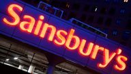 Illuminated signage is seen at a branch of the Sainsbury's supermarket in London, Britain, January 7, 2022. REUTERS/Toby Melville