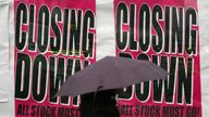 A woman walks by a shop advertising its closure in Croydon, south London, Friday, Jan. 23, 2009. The British economy has officially sunk into recession, with government figures Friday showing the economy shrank 1.5 percent in the fourth quarter of last year as the financial crisis ravaged banks, retail and manufacturing. It was the biggest decline since the early days of Margaret Thatcher's government nearly 30 years ago. (AP Photo/Sang Tan)