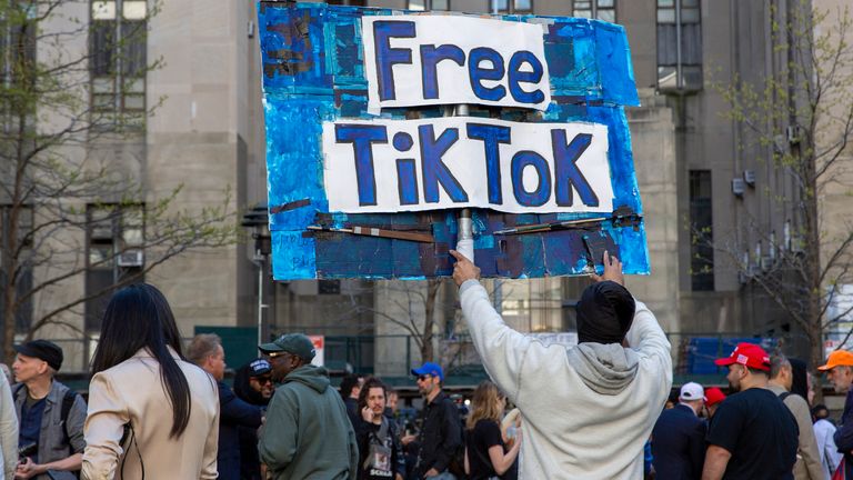 A man carries a Free TikTok sign in April 2024. File pic: AP