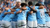 Manchester City FC players huddle up before a soccer game against AC Milan, Saturday, July 27, 2024, in New York. (AP Photo/Pamela Smith)