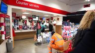 People inside a branch of the Post Office in Paddington,.
Pic: PA
